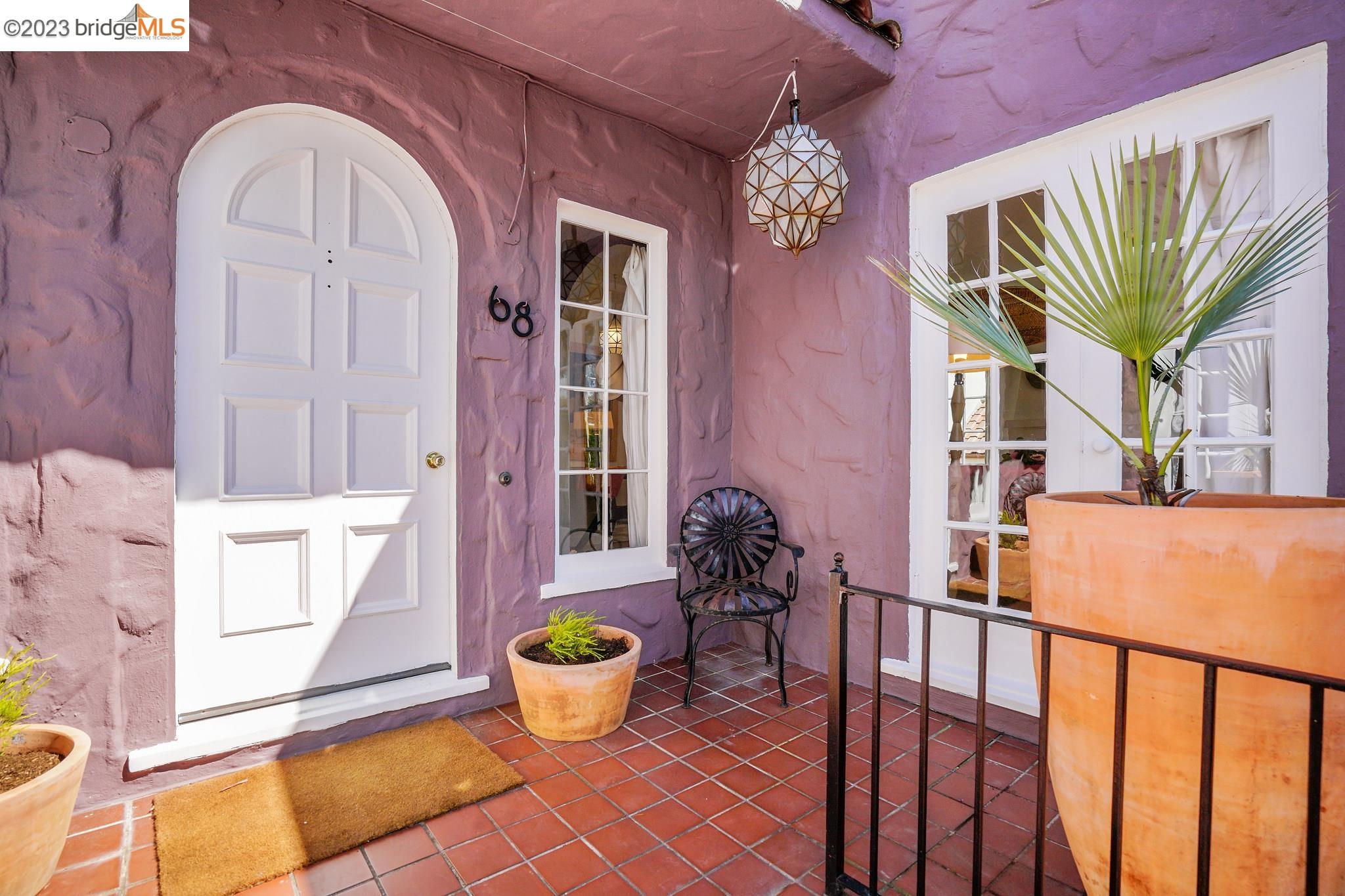 a view of a dining room with a window and wooden floor
