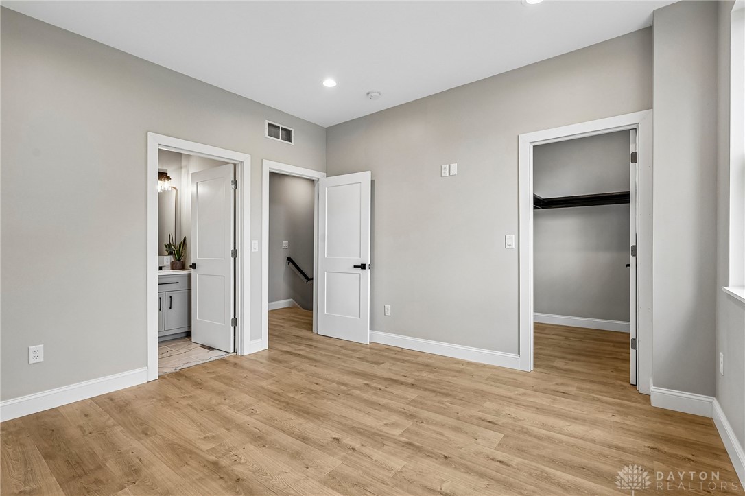 3906 Edwards Road, Unit C Cincinnati, OH 45209 - Photo 34 of 46 Bright and airy room with sleek flooring, leading to a well-appointed bathroom and ample closet space.