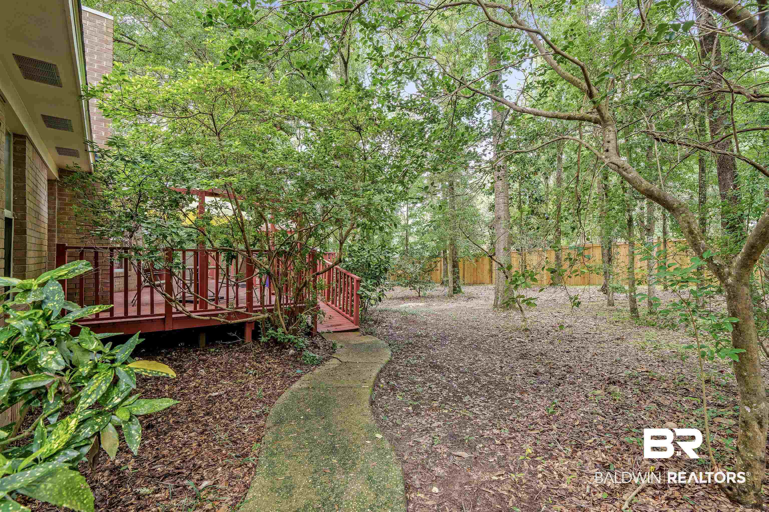305 Beall Lane Daphne, AL 36526 - Photo 27 of 28 Paved Path to Back Deck