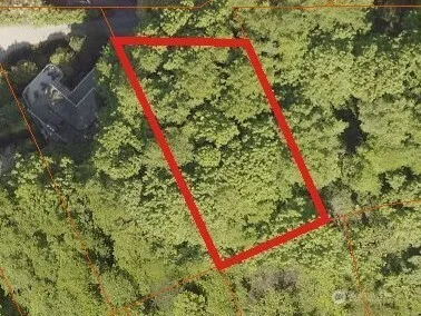 a view of a room with an empty space and a sink