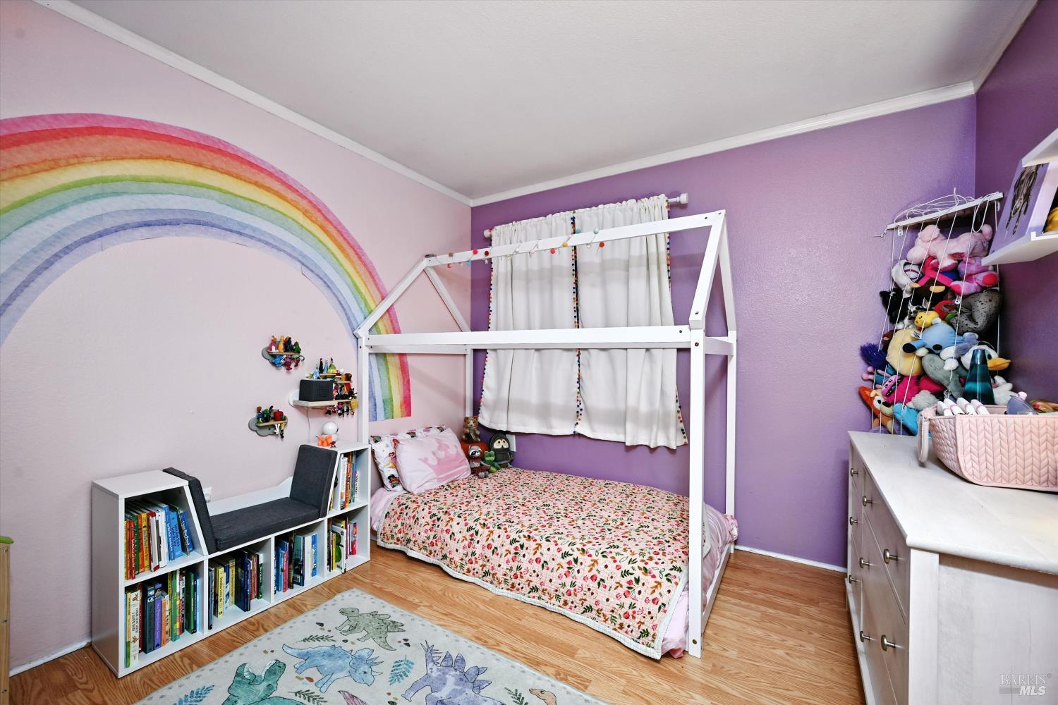 27 Fredrick Drive Rohnert Park, CA 94928 - Photo 18 of 26 a living room with baby crib furniture and a book shelf