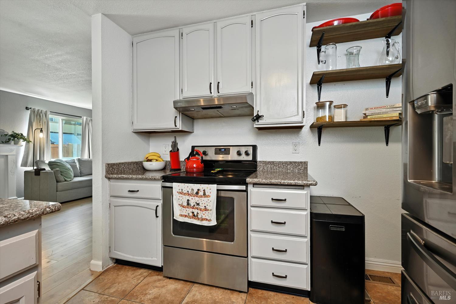 27 Fredrick Drive Rohnert Park, CA 94928 - Photo 9 of 26 a kitchen with stainless steel appliances granite countertop a stove and a cabinets