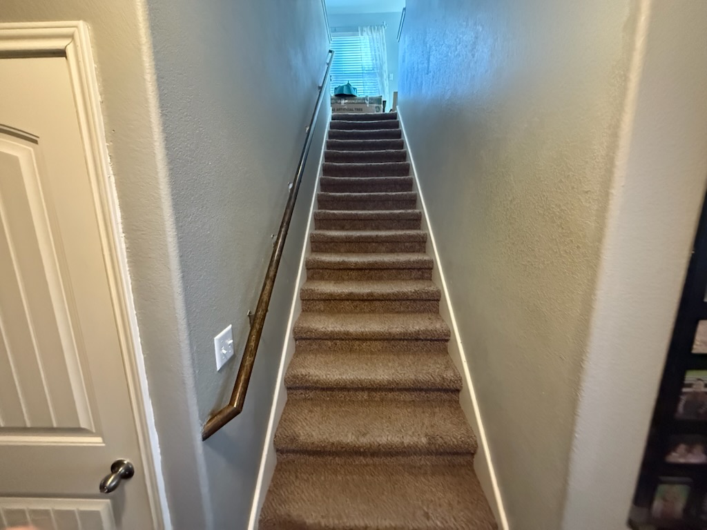 351 Wincliff Drive Buda, TX 78610 - Photo 14 of 25 Stairway featuring a textured wall and baseboards