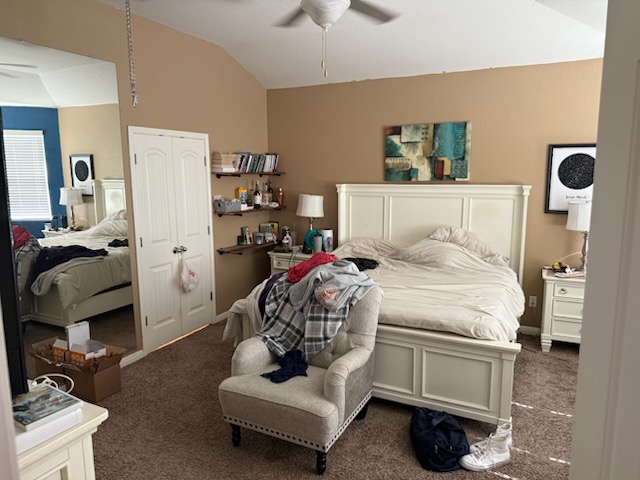 351 Wincliff Drive Buda, TX 78610 - Photo 17 of 25 Carpeted bedroom featuring lofted ceiling, a closet, and a ceiling fan
