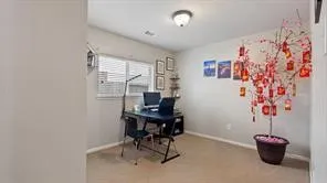 a room with a table and chairs