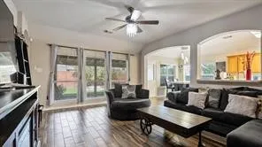 a living room with furniture and a flat screen tv