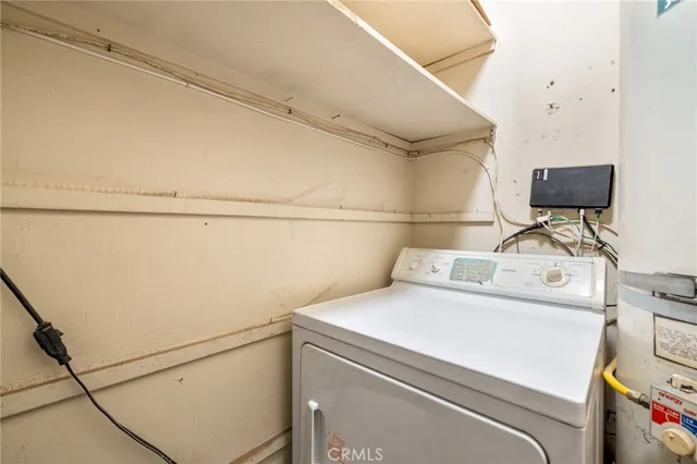 a view of balcony with furniture and a potted plant