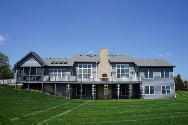43W145 Campton Hills Road Elburn, IL 60119 - Photo 22 of 23 a view of a house with a garden and deck