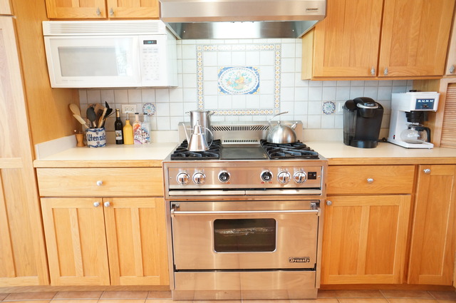 43W145 Campton Hills Road Elburn, IL 60119 - Photo 7 of 23 a kitchen with a stove and a white refrigerator