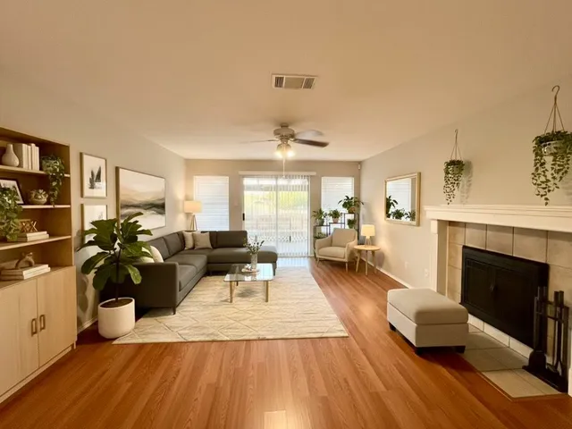 a living room with furniture and a fireplace