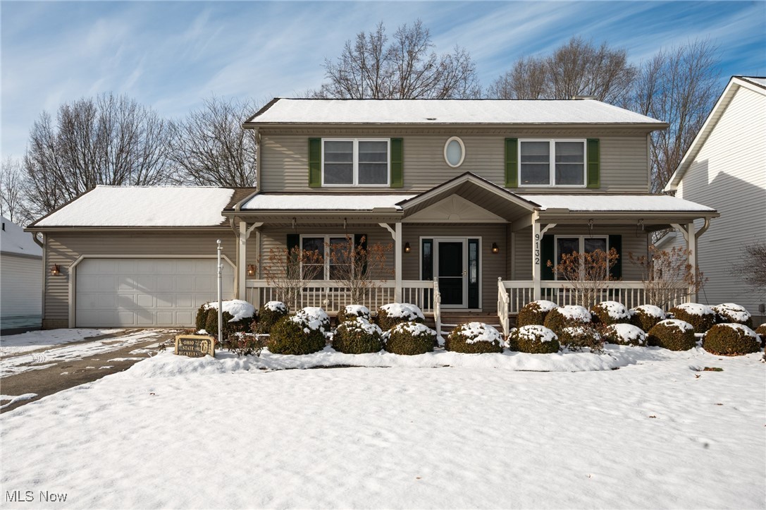 9132 Reed Road North Ridgeville, OH 44039 - Photo 1 of 43 View of front of house featuring a porch and an attached garage