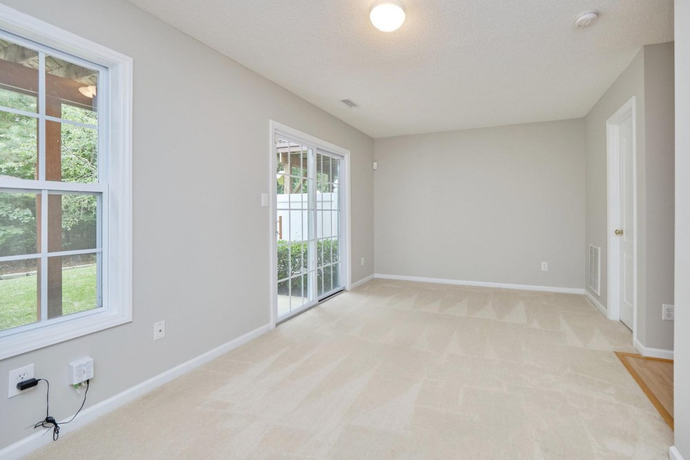 1437 Basinger Court Raleigh, NC 27612 - Photo 5 of 30 Large back bedroom/bonus room with sliding door to lower patio. Bedroom/Bonus Room