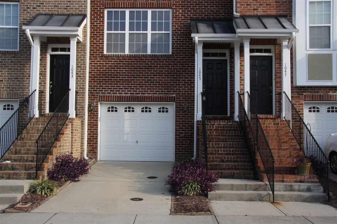 a front view of a house with a garage
