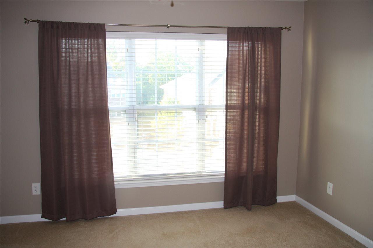 1045 Summerhouse Road Cary, NC 27519 - Photo 14 of 20 a view of an empty room with a window