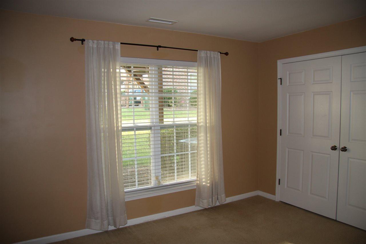 1045 Summerhouse Road Cary, NC 27519 - Photo 17 of 20 a view of an empty room with a window