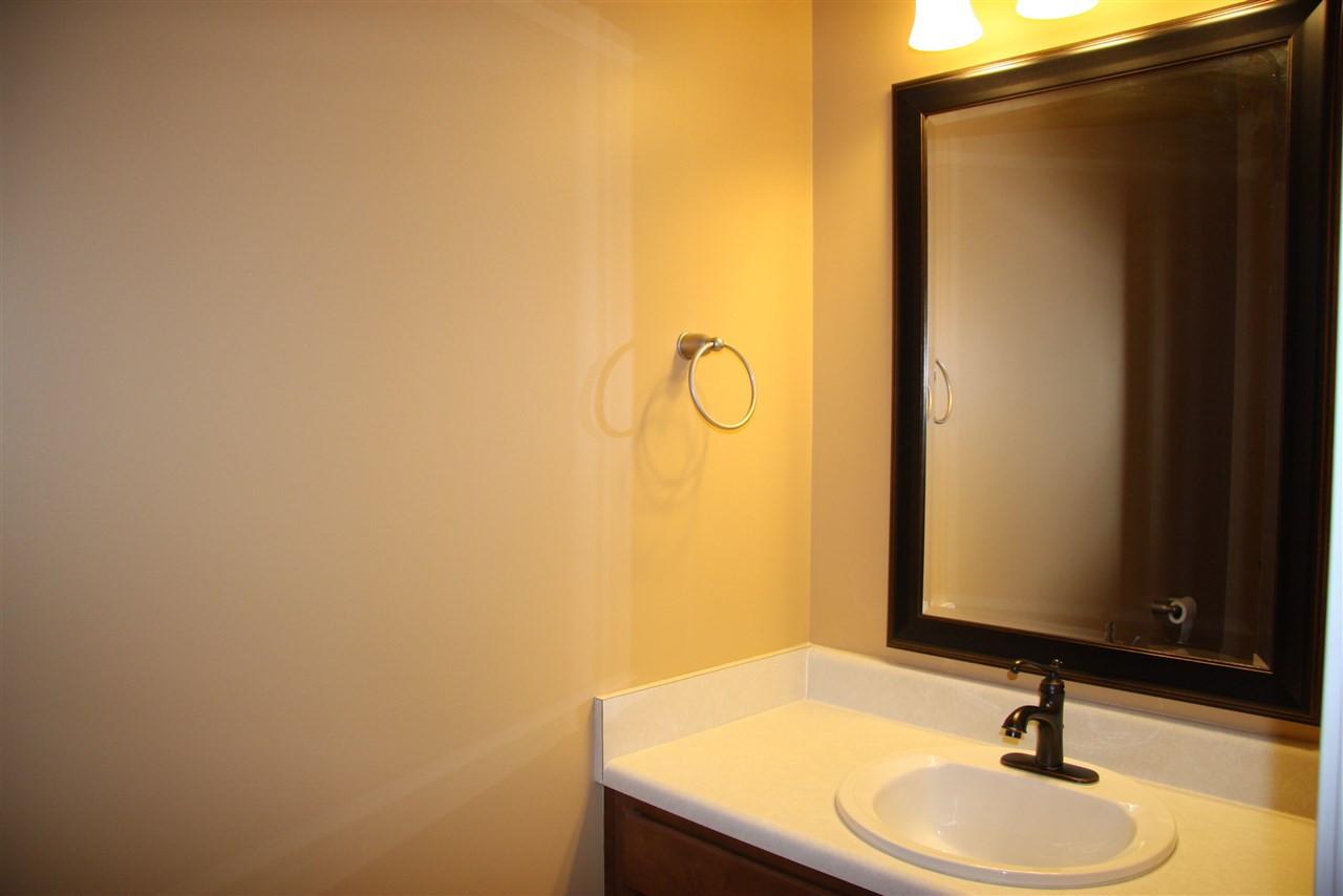 1045 Summerhouse Road Cary, NC 27519 - Photo 7 of 20 a bathroom with a sink and a mirror