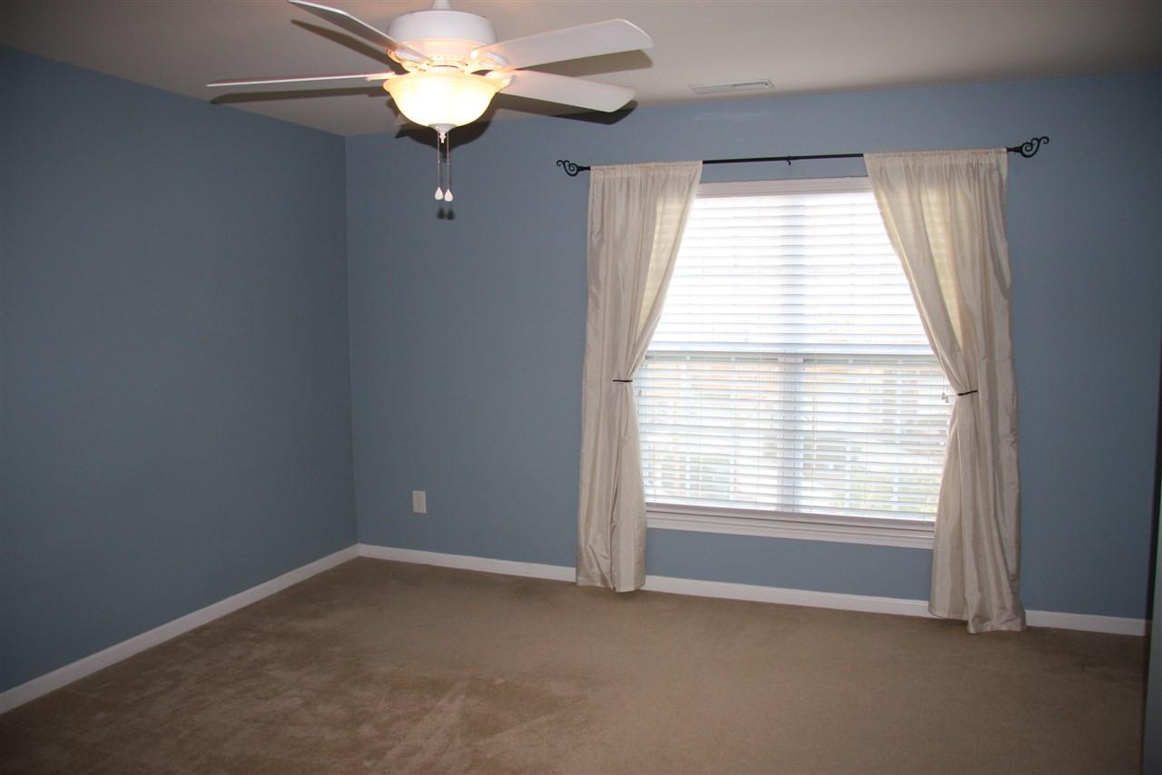 1045 Summerhouse Road Cary, NC 27519 - Photo 10 of 20 a view of a livingroom with a fan