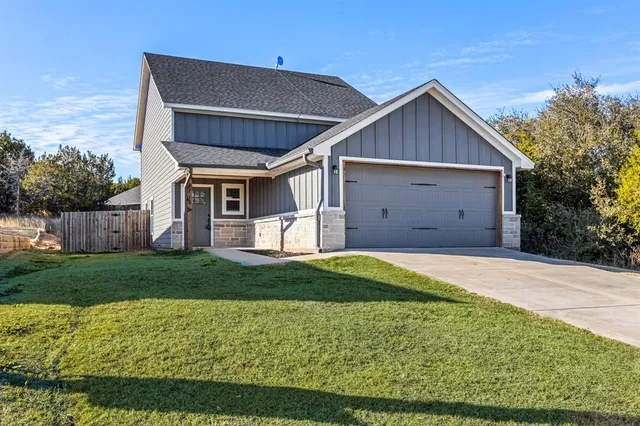 a view of a backyard of the house