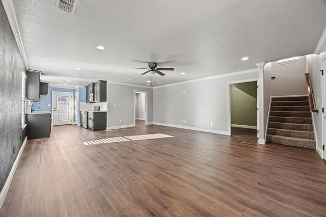 a view of a livingroom with wooden floor