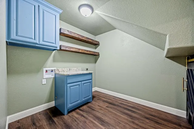 a view of cabinets and wooden floor
