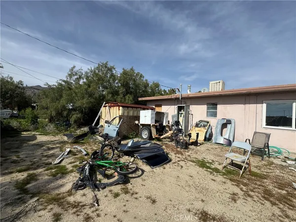 a view of a terrace with furniture and stove