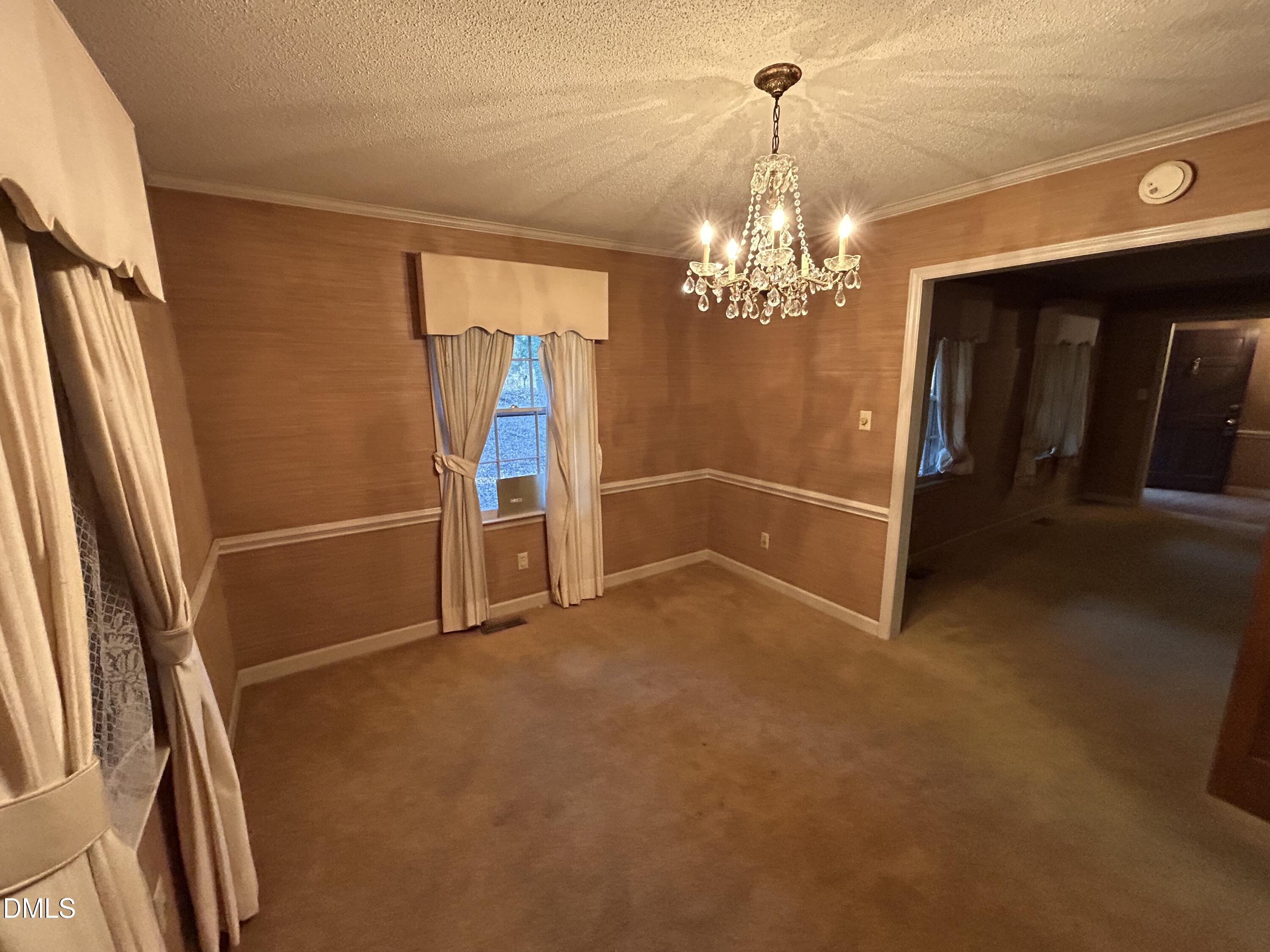 2912 Oxford Road Henderson, NC 27536 - Photo 12 of 25 a view of an empty room with a window