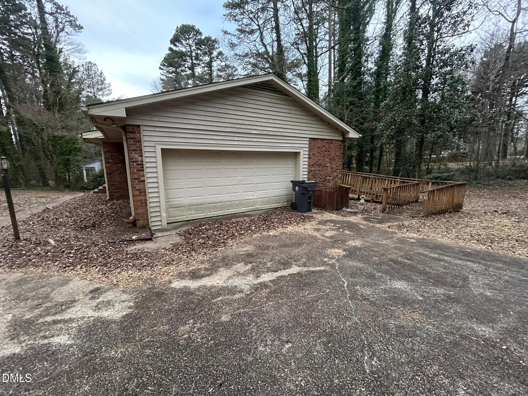 2912 Oxford Road Henderson, NC 27536 - Photo 4 of 25 a backyard of a house with yard and outdoor seating