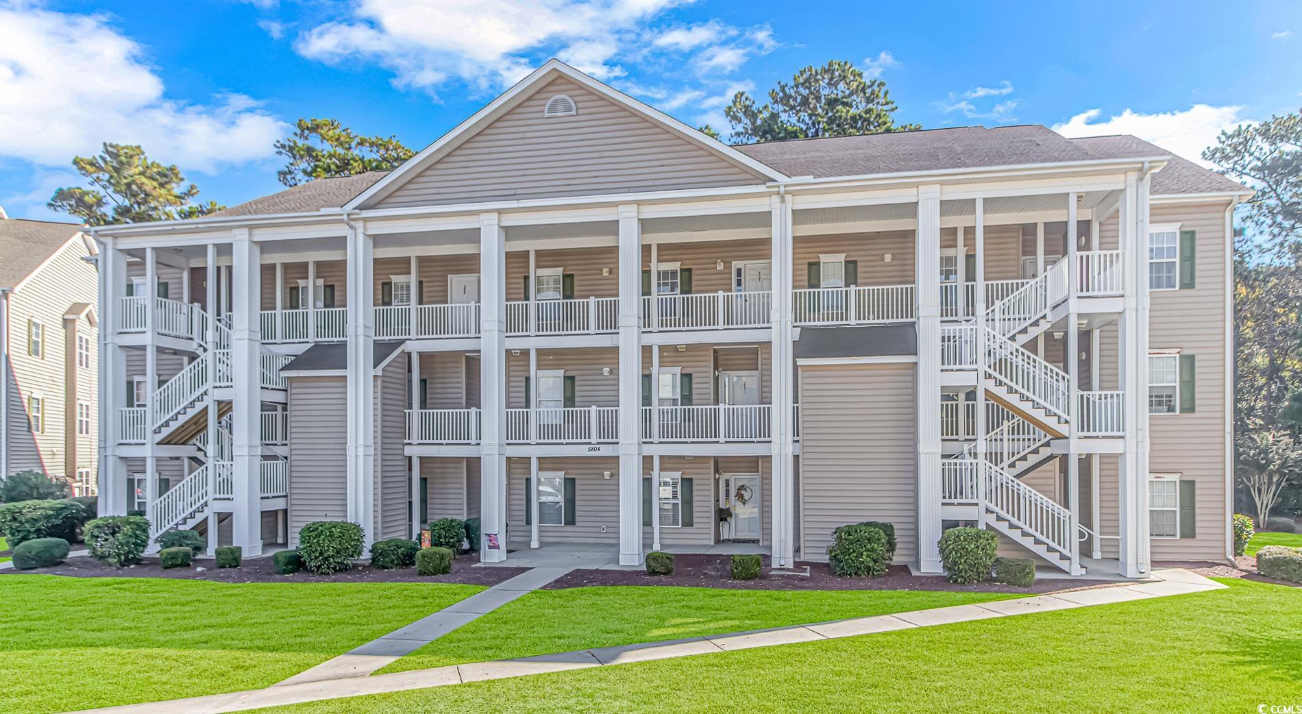 5804 Longwood Drive, Unit 203 Murrells Inlet, SC 29576 - Photo 1 of 31 View of building exterior