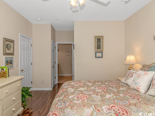 5804 Longwood Drive, Unit 203 Murrells Inlet, SC 29576 - Photo 16 of 31 Bedroom with dark hardwood / wood-style floors and ceiling fan