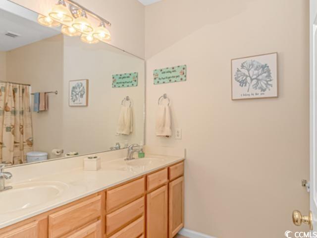5804 Longwood Drive, Unit 203 Murrells Inlet, SC 29576 - Photo 17 of 31 Bathroom with toilet and vanity