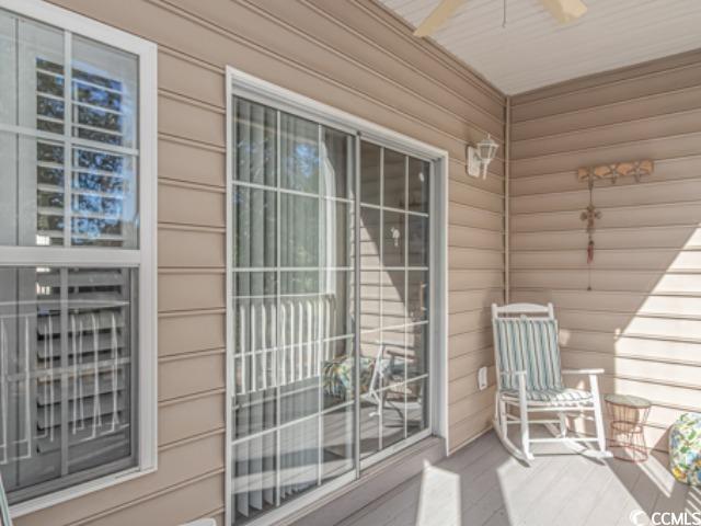 5804 Longwood Drive, Unit 203 Murrells Inlet, SC 29576 - Photo 25 of 31 Balcony featuring ceiling fan