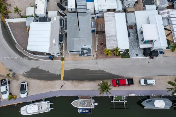 an aerial view of houses with outdoor space