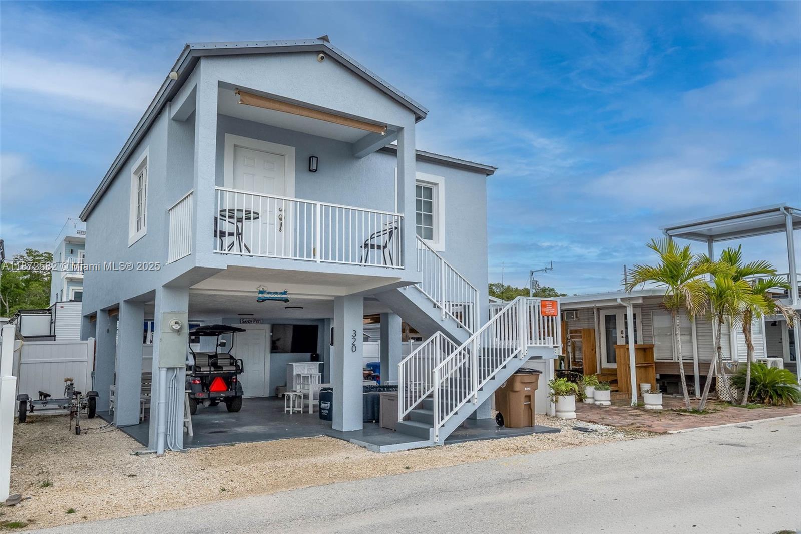 325 Calusa Street, Unit 320 Key Largo, FL 33037 - Photo 2 of 52 a view of a house with potted plants