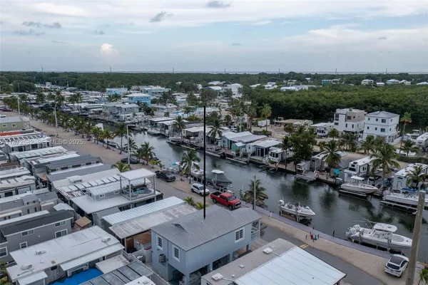 a view of a car is parked in front of a building