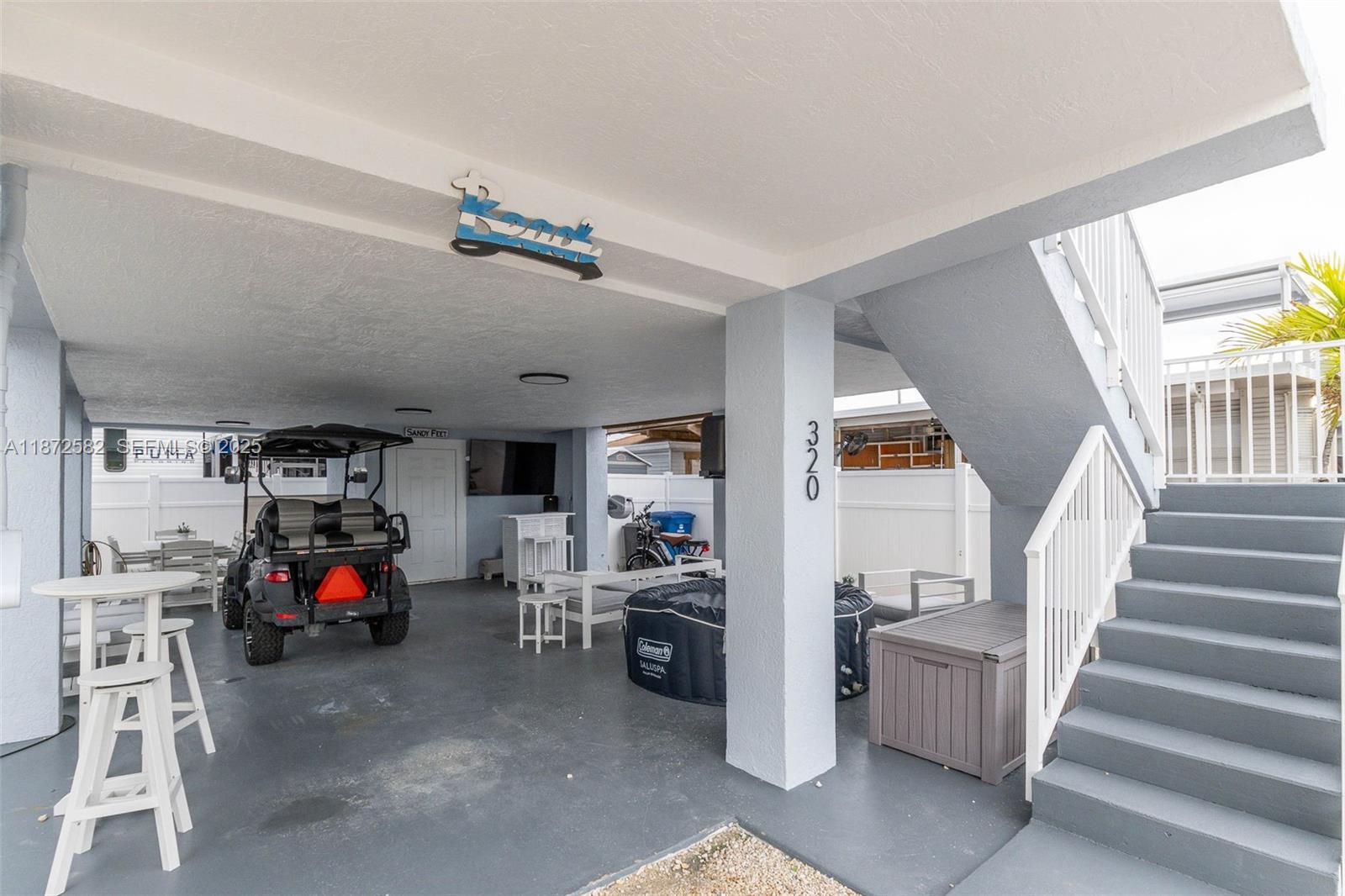325 Calusa Street, Unit 320 Key Largo, FL 33037 - Photo 4 of 52 a living room with furniture and a car park