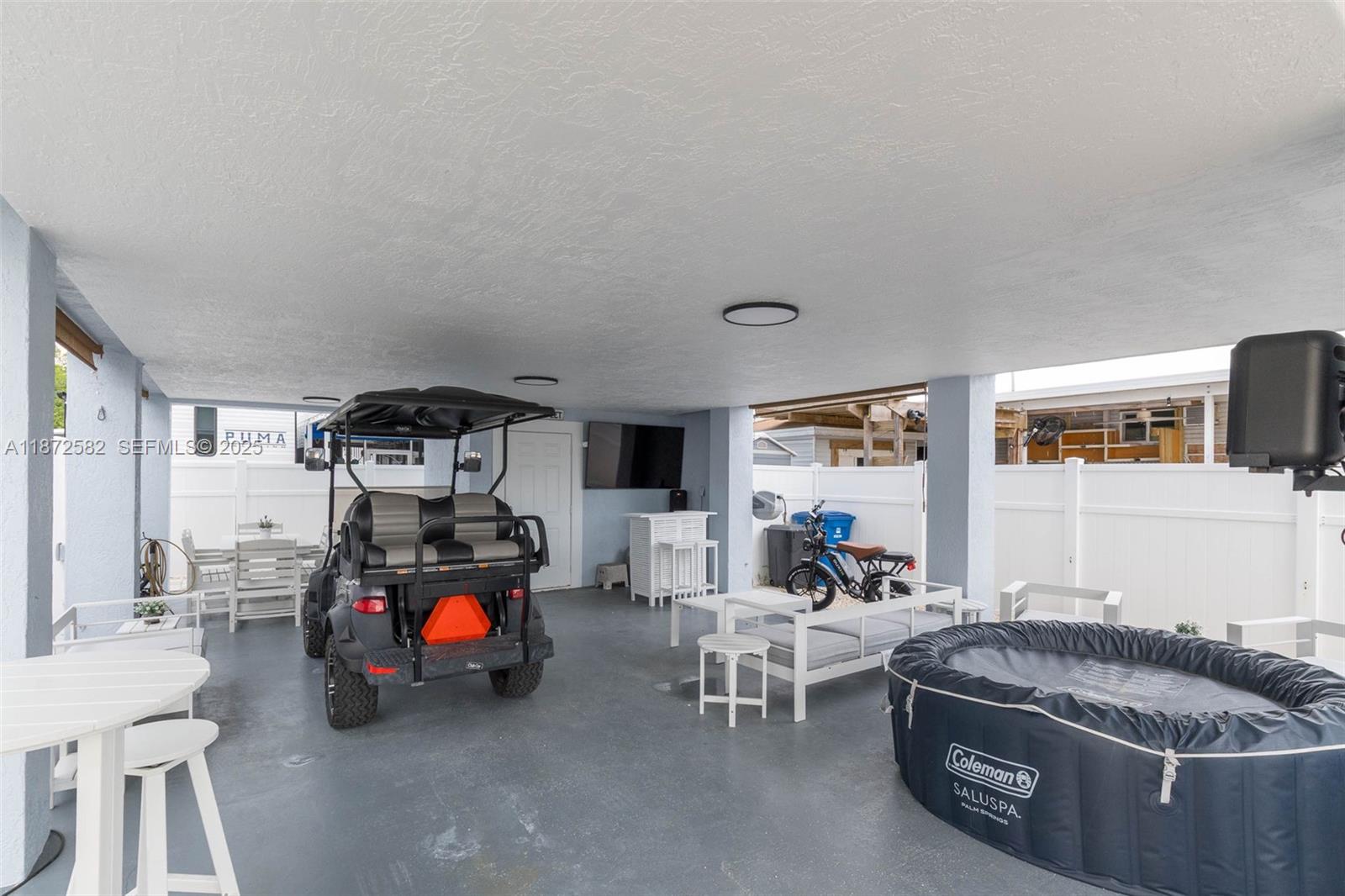 325 Calusa Street, Unit 320 Key Largo, FL 33037 - Photo 5 of 52 a living room with furniture and a flat screen tv