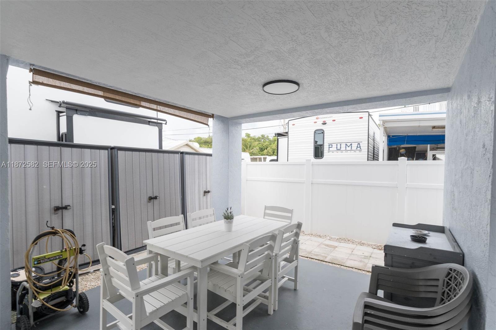 325 Calusa Street, Unit 320 Key Largo, FL 33037 - Photo 7 of 52 a dining room with furniture and wooden floor