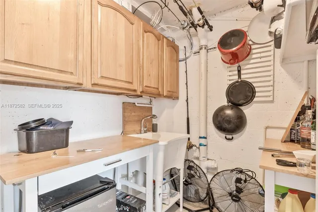 a kitchen with a refrigerator and a stove
