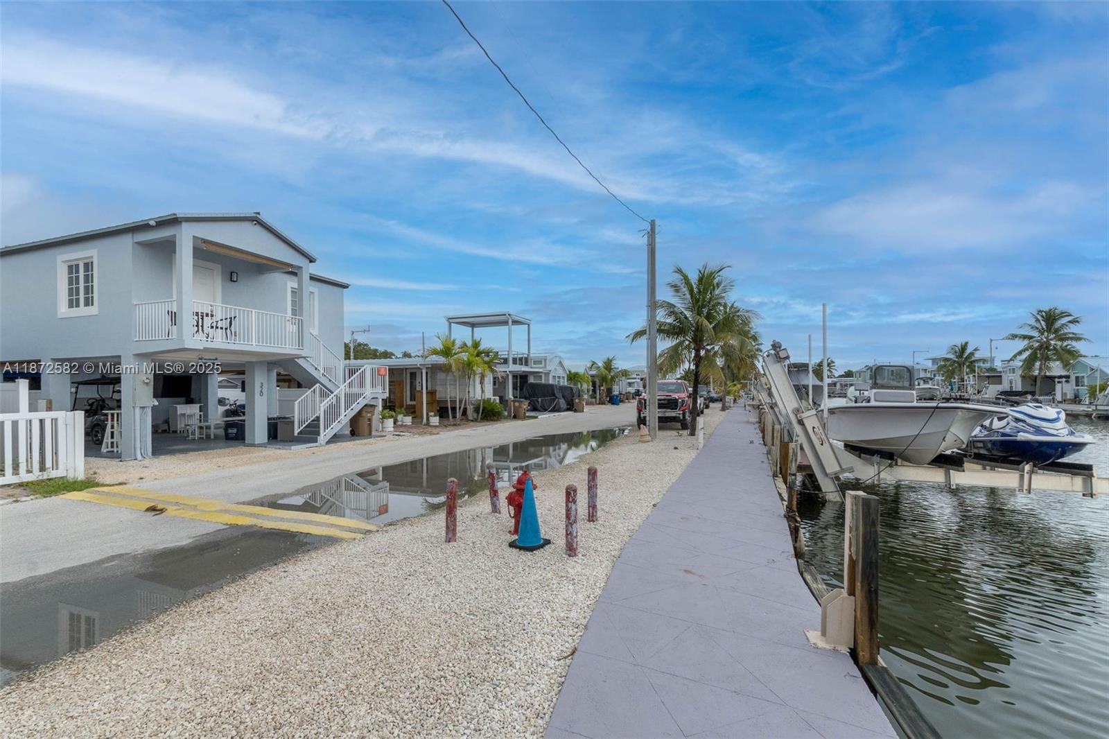 325 Calusa Street, Unit 320 Key Largo, FL 33037 - Photo 10 of 52 a view of a swimming pool with outdoor seating