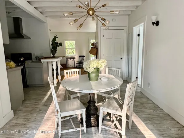 a dining room with furniture and window