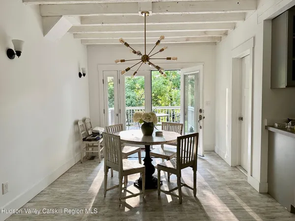 a kitchen with stainless steel appliances a sink stove and cabinets