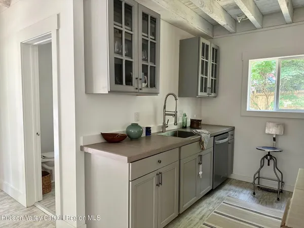 a view of room with window and hardwood floor