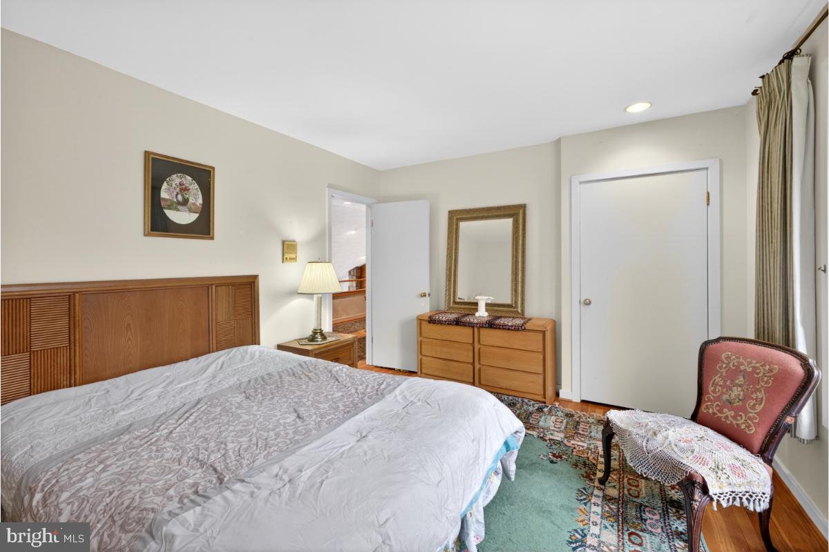 10320 Glen Road Potomac, MD 20854 - Photo 30 of 75 a bedroom with a bed and furniture