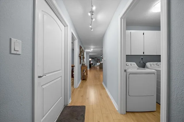 a view of bathroom with a washer and dryer