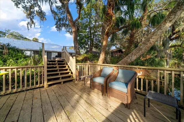 a view of balcony with deck and outdoor seating