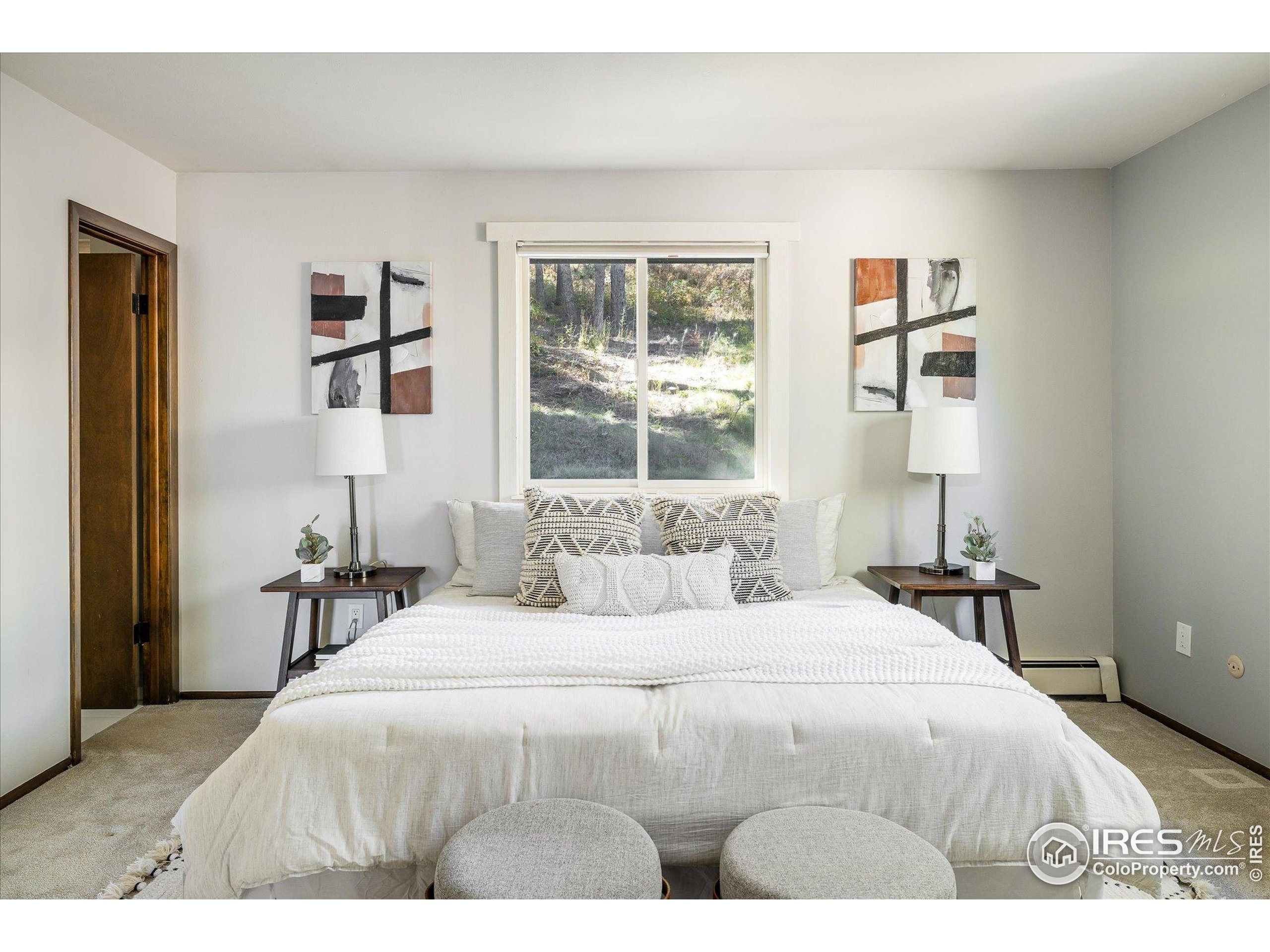 74 Sky Trail Road Boulder, CO 80302 - Photo 14 of 34 a bedroom with a bed and a window