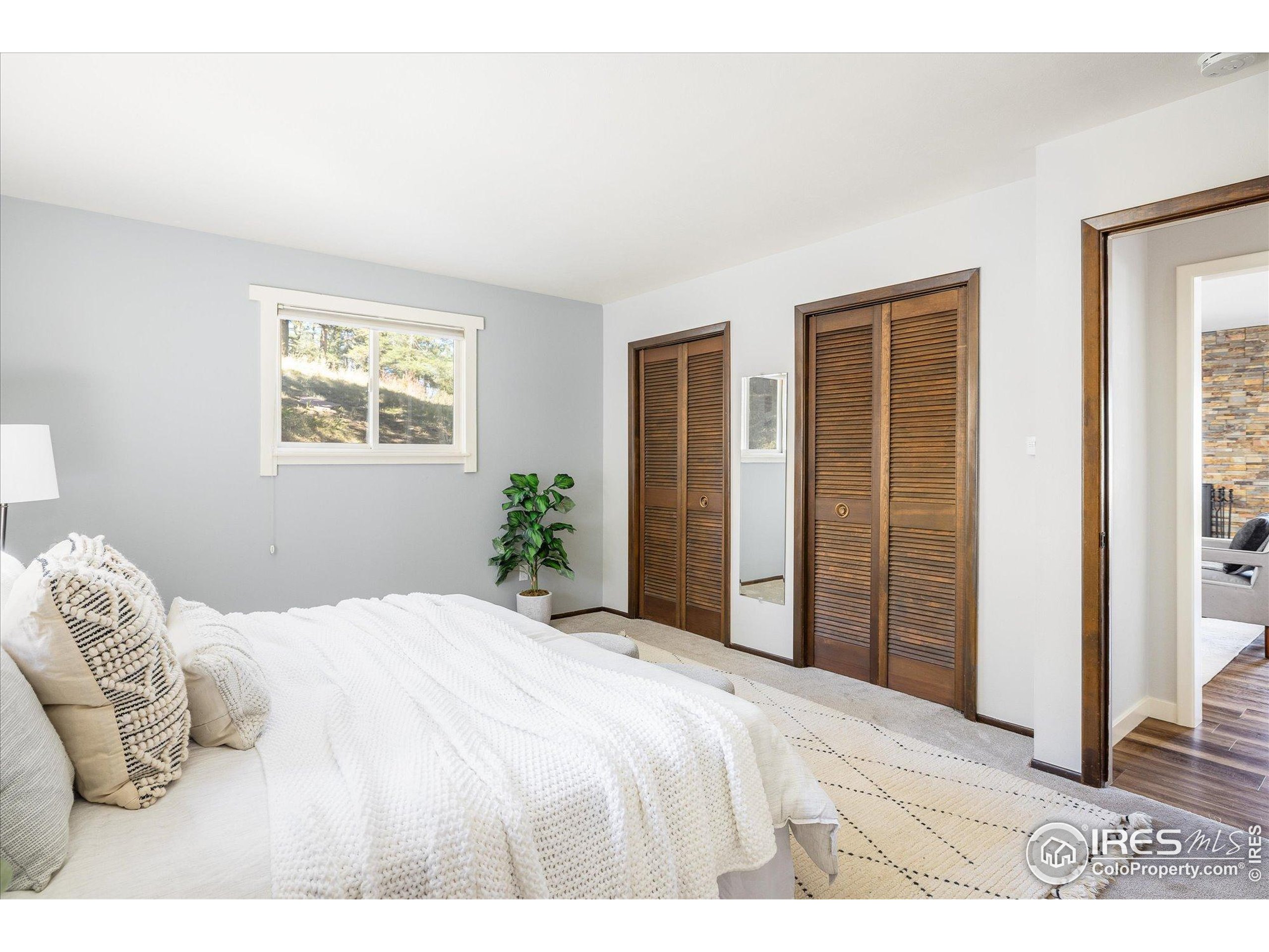 74 Sky Trail Road Boulder, CO 80302 - Photo 15 of 34 a bedroom with a bed and a window