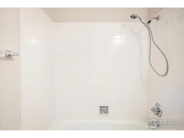 a picture of a bathroom with a shower