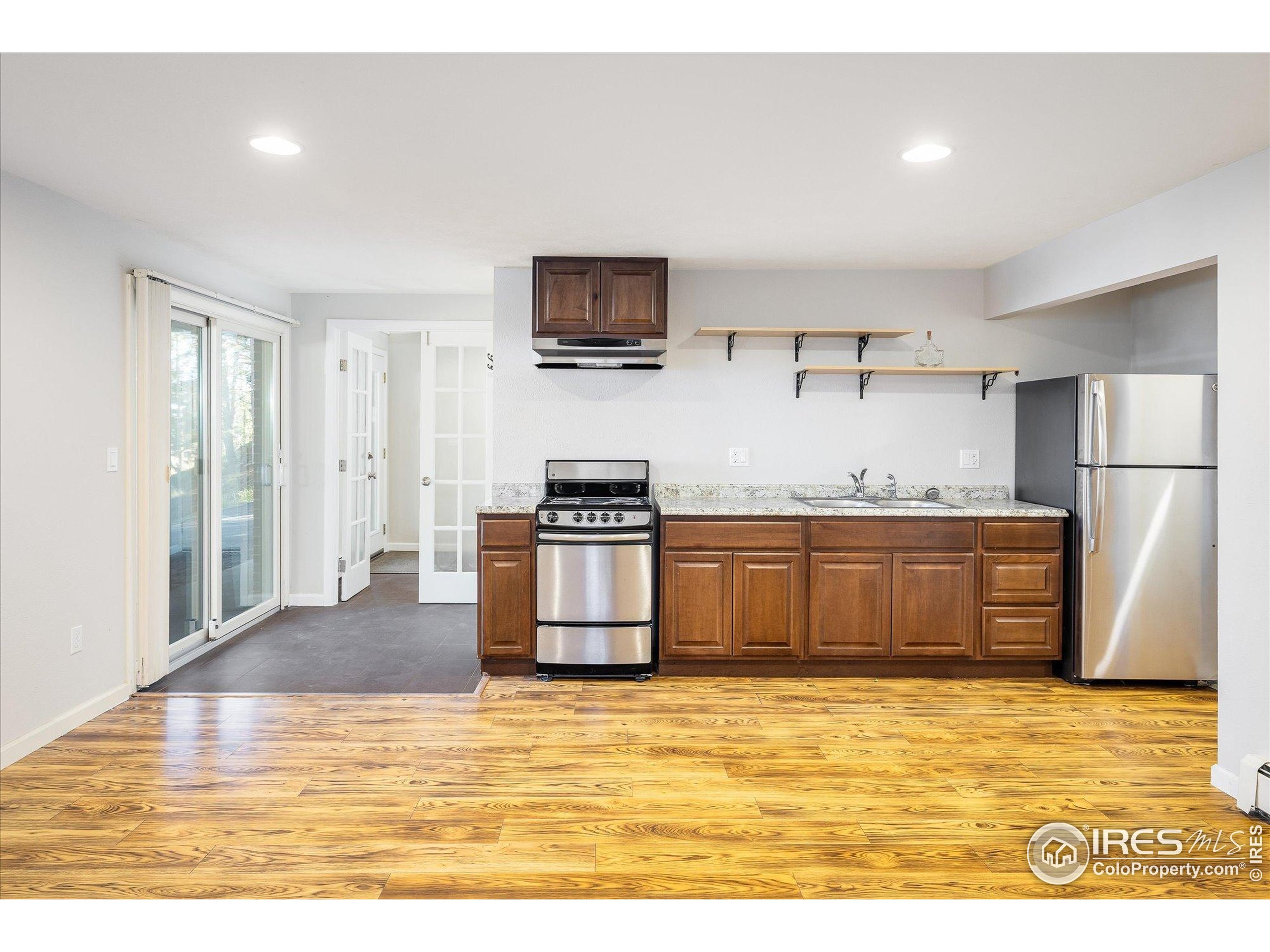 74 Sky Trail Road Boulder, CO 80302 - Photo 20 of 34 a kitchen with stainless steel appliances granite countertop a refrigerator sink and stove