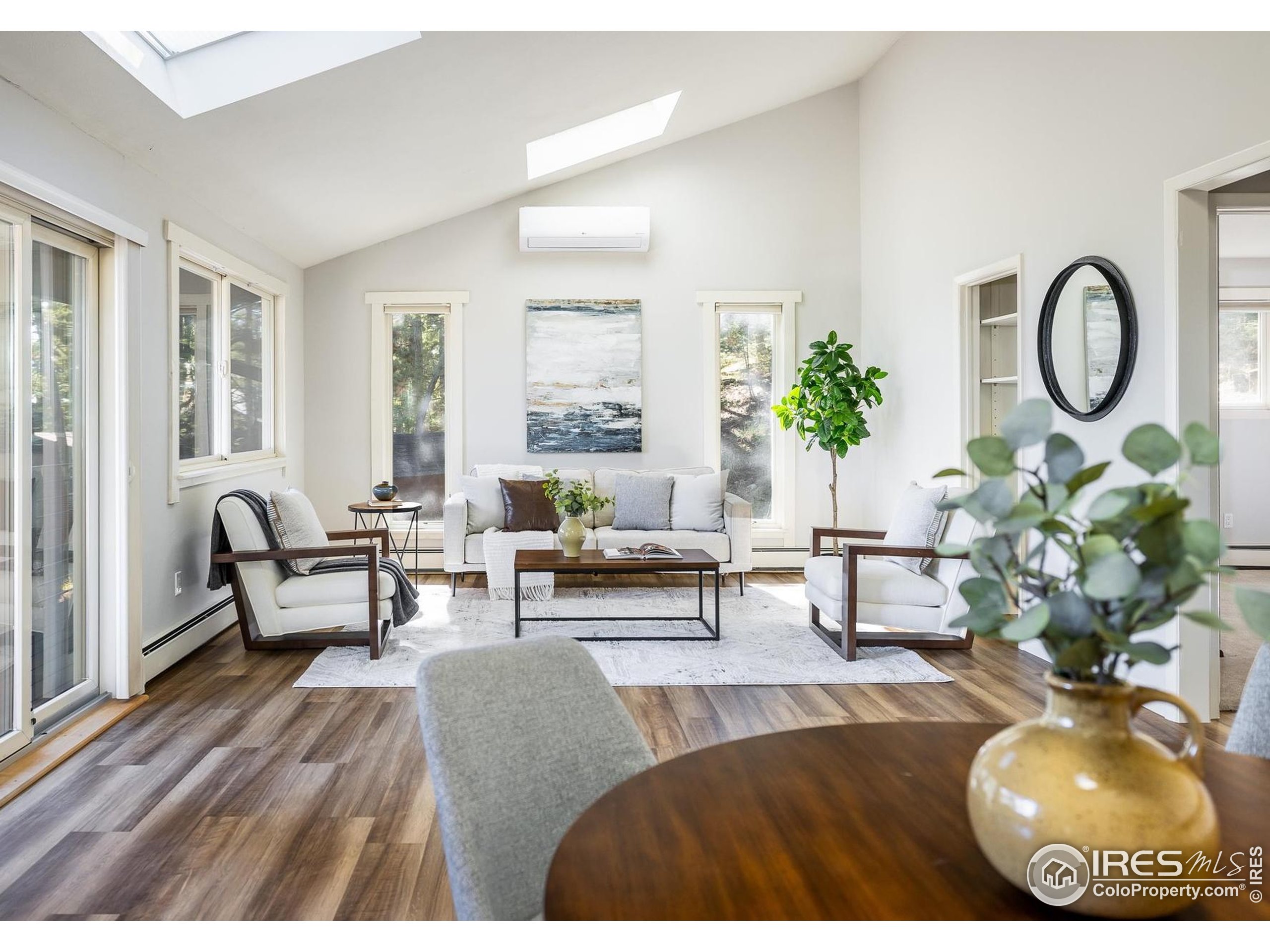 74 Sky Trail Road Boulder, CO 80302 - Photo 4 of 34 a living room with furniture and a potted plant